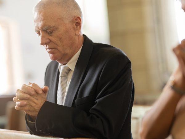 Praying, religion and senior man in church for spiritual christian worship, faith and belief. Praye